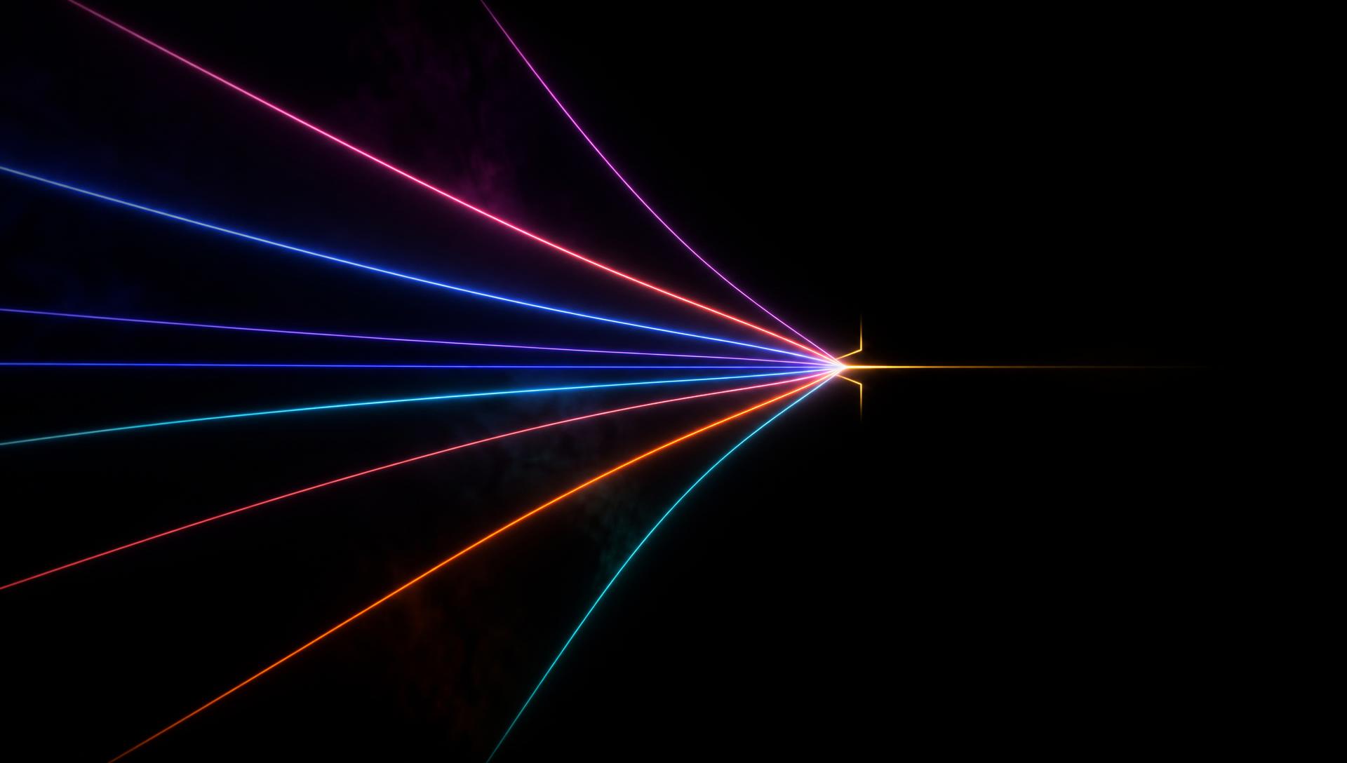 Reference frame, many distinct coloured light streaks converging into a single bright junction against black